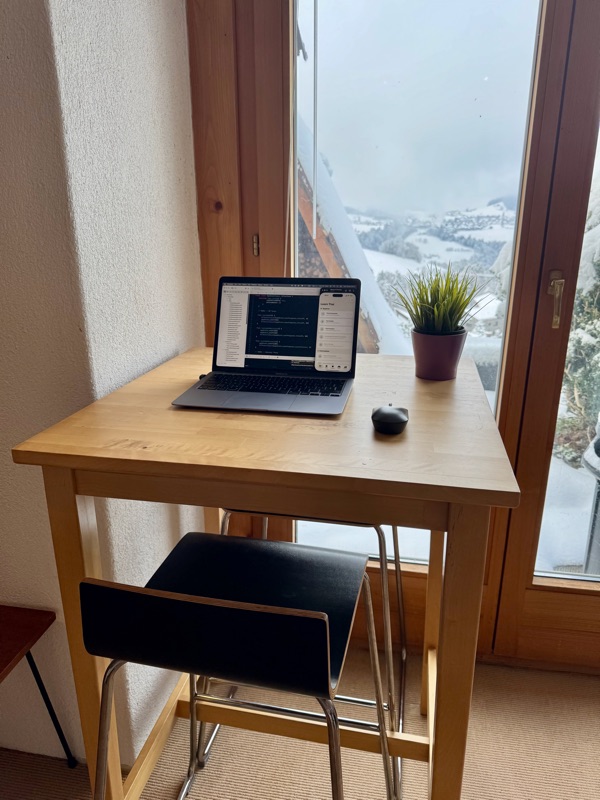 KK Studio — a tiny kitchen desk overlooking the Swiss mountains
